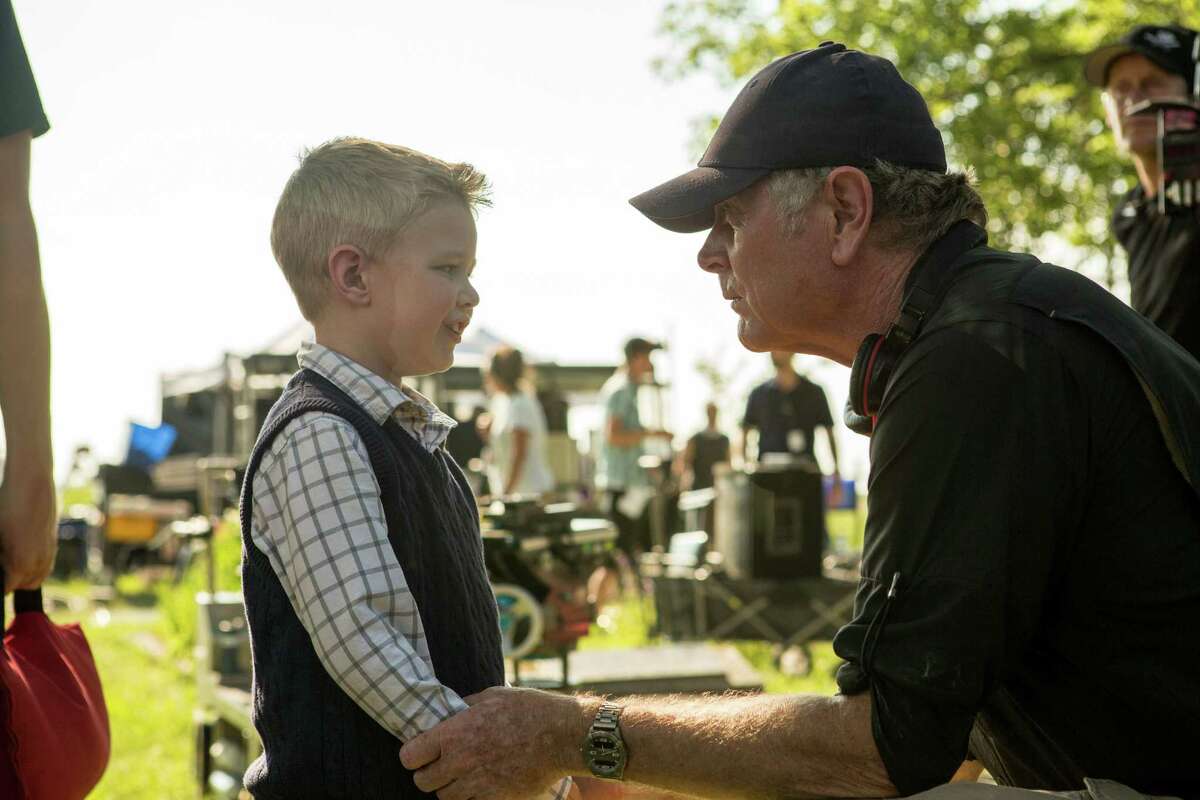 This image released by Sony Pictures shows actor Connor Corum, left, with director Randall Wallace on the set of TriStar Pictures' "Heaven Is For Real." (AP Photo/Sony Pictures, Allen Fraser) ORG XMIT: NYET130