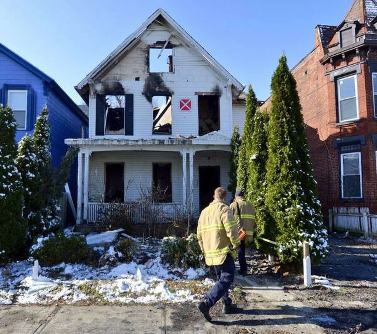 Troy firefighters remained at the scene of an overnight fire that gutted a home at 44 Glen Ave., Troy, on Wednesday, April 16, 2014. (Skip Dickstein / Times Union)