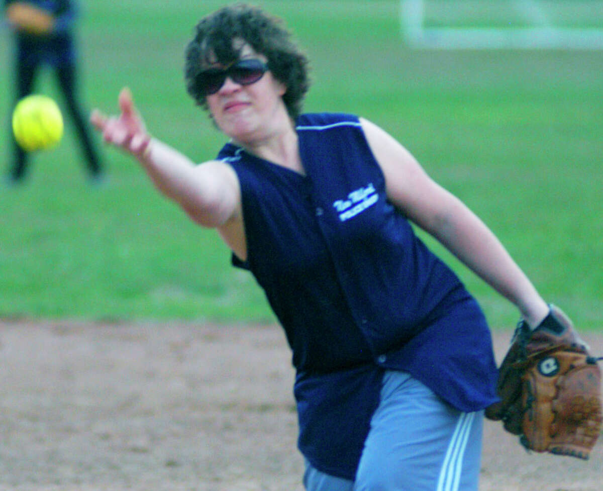 Batter up! Suzie Anderson of the New Milford Police Union women's softball team delivers a pitch to the plate Monday at 'A' field along Pickett District Road on opening night for New Millford Parks & Recreation's expansive adult slowpitch softball leagues. Entering the 52nd season of adult softball in town, the program features nine women's teams and 34 men's teams. Games are played weeknights at Young's Field and 'A' field. For more photos, see the April 25 edition of The Spectrum and visit www.newmilfordspectrum.com. For more information about the leagues, call Parks & Recreation at 860-355-6050.