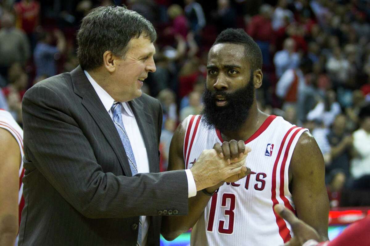 Houston Rockets head coach Kevin McHale, left, celebrates the Rockets 104-98 win over the San Antonio Spurs with Rockets guard James Harden (13) during the second half of an NBA basketball game at Toyota Center Monday, April 14, 2014, in Houston.