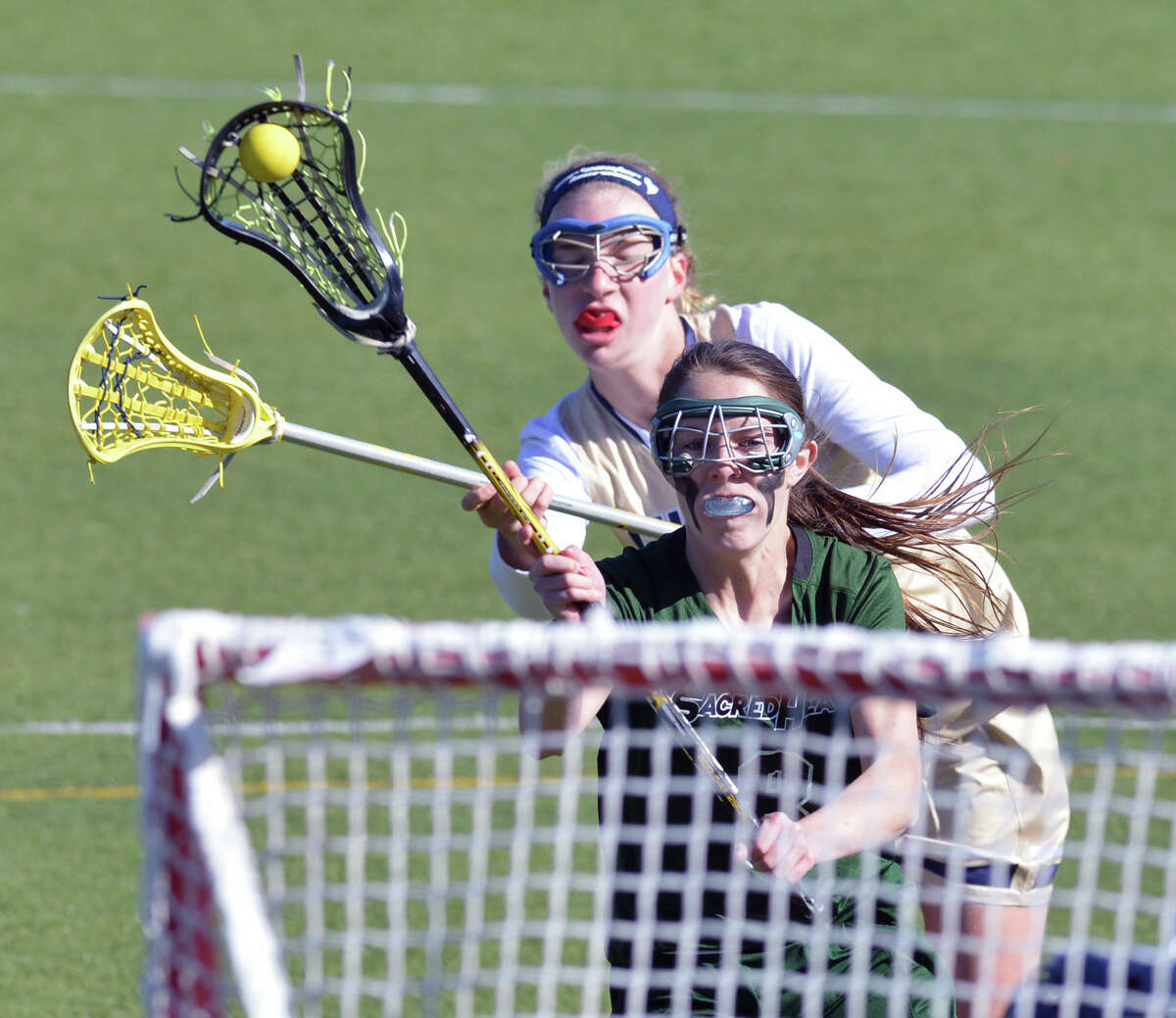 Convent of the Sacred Heart's Charlotte Jeffrey (#8) shoots during the high school lacrosse match between Convent of the Sacred Heart and Choate at Convent in Greenwich, Wednesday, April 16, 2014.