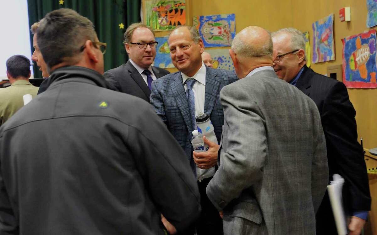 Developer David Flaum, center, greets people after a public forum about the casino plans for Albany at Giffen Memorial Elementary School on Wednesday, April 16, 2014 in Albany, N.Y. (Lori Van Buren / Times Union)