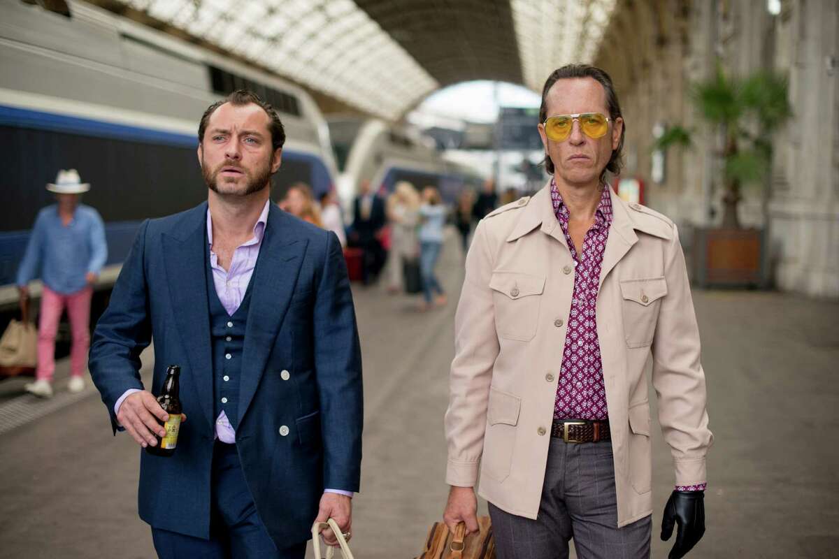 This image released by Fox Searchlight Pictures shows Jude Law, left, and Richard E. Grant in a scene from "Dom Hemingway." (AP Photo/Fox Searchlight Pictures, Nick Wall)