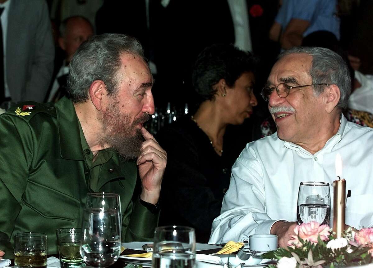 In this March 3, 2000 file photo, Cuba's leader Fidel Castro, left, and Colombian Nobel laureate Gabriel Garcia Marquez speak during a dinner at the annual cigar festival in Havana, Cuba. Marquez died on Thursday, April 17, 2014 at his home in Mexico City.