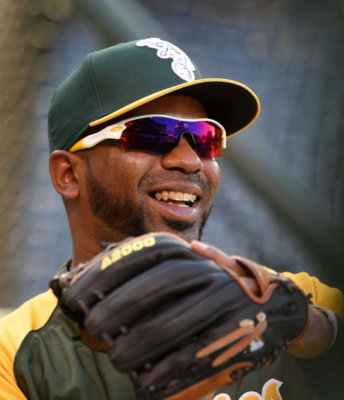 Oakland Athletics' Alberto Callaspo wams up prior to the Athletics' baseball game against the Los Angeles Angels, Wednesday, April 16, 2014, in Anaheim, Calif. (AP Photo/Mark J. Terrill)