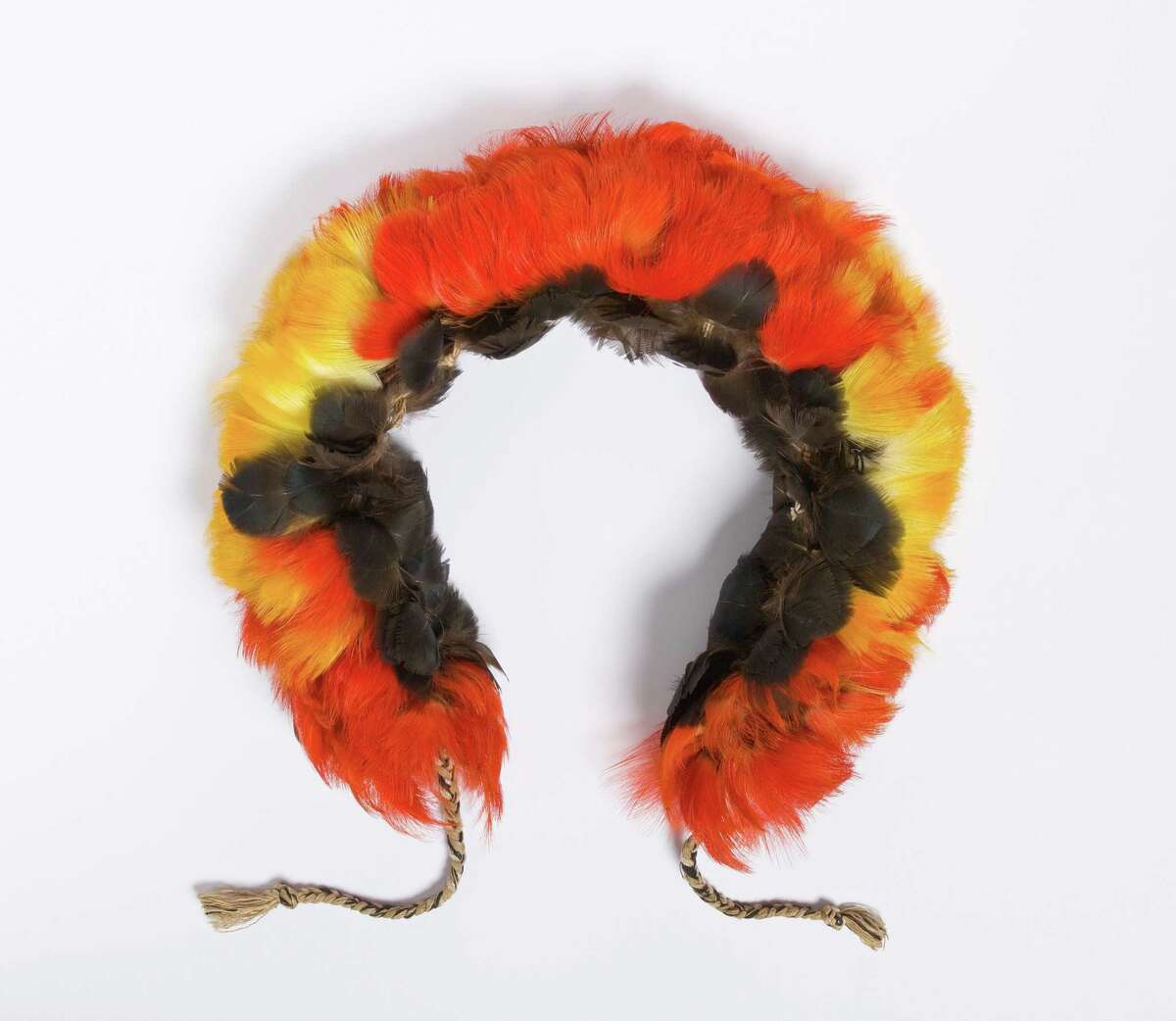 This feather headdress, ca.1920s âÄì 30s, is probably from South America, possibly Bolivia, and was a gift to the Bruce Museum from Georgiana Windsor. It was last on display in the museum's 1997 exhibition "The Splendor of Adornment."