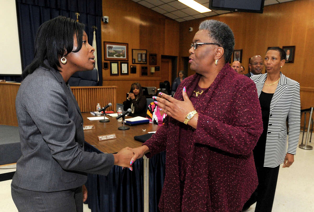 Ann Westbrooks was named Tuesday as the Beaumont Independent School District's new CFO/Comptroller. Westbrooks, left, is greater by the board after the announcement. Photo taken Tuesday, April 08, 2014 Guiseppe Barranco/@spotnewsshooter