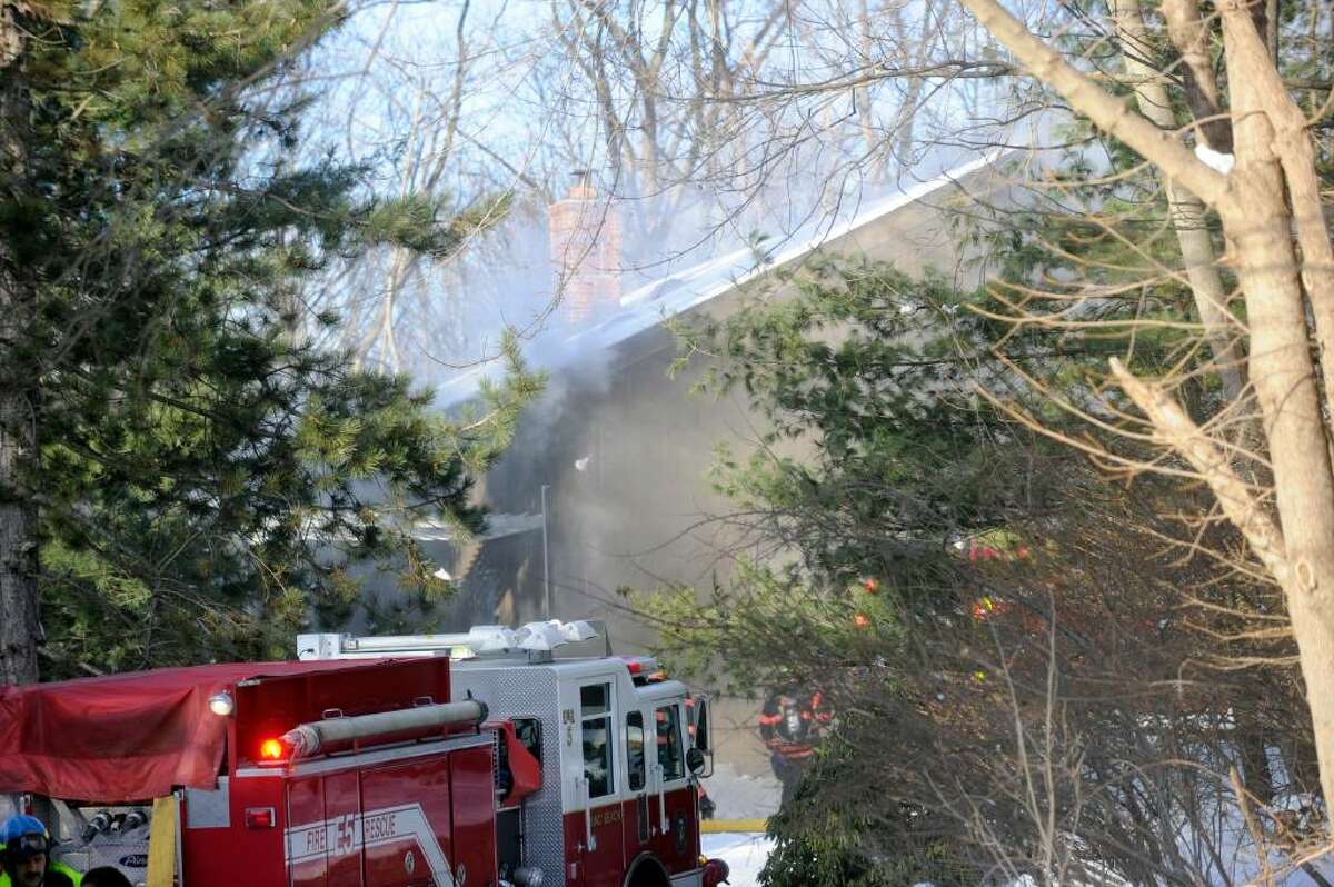 Smoke billows during a structure fire at 295 Palmer Circle Thursday afternoon February 11, 2010.