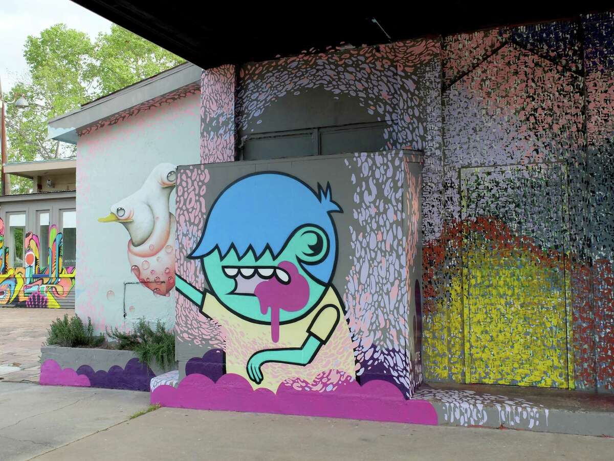 The gray exterior of the rambling Avis Frank Gallery in the Heights has been transformed into a series of colorful murals by Houston street artists.
