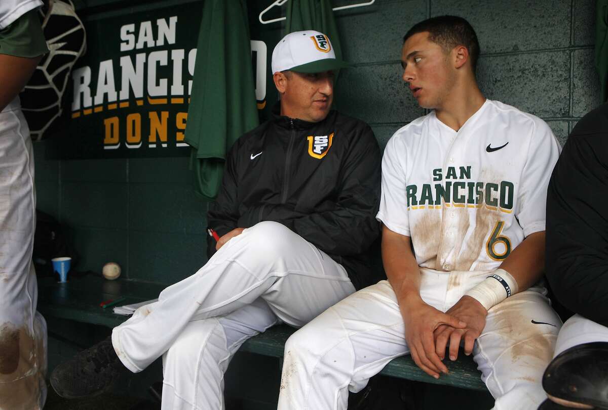 USF's Nino Giarratano embraces coaching son, Nico