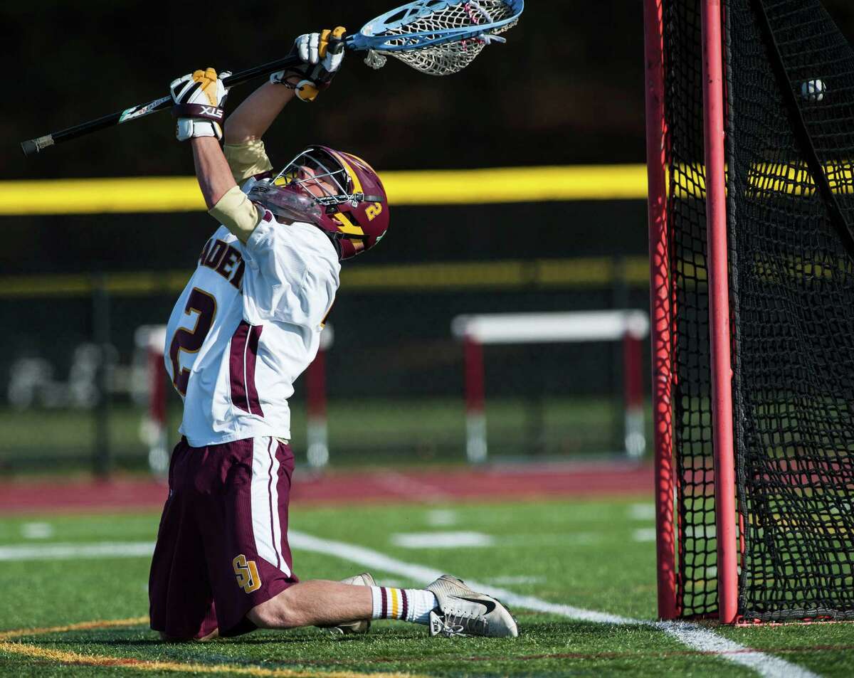 A shot gets by St Joseph high school goalie Mike Braddick during a boy's lacrosse game against Greenwich high school played at St Joseph high school, Trumbull, CT on Saturday, April, 19th, 2014.