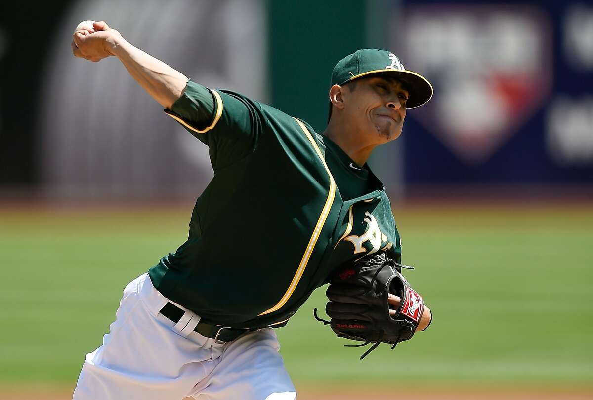 OAKLAND, CA - APRIL 20: Jesse Chavez #60 of the Oakland Athletics pitches against the Houston Astros in the top of the first inning at O.co Coliseum on April 20, 2014 in Oakland, California. (Photo by Thearon W. Henderson/Getty Images)