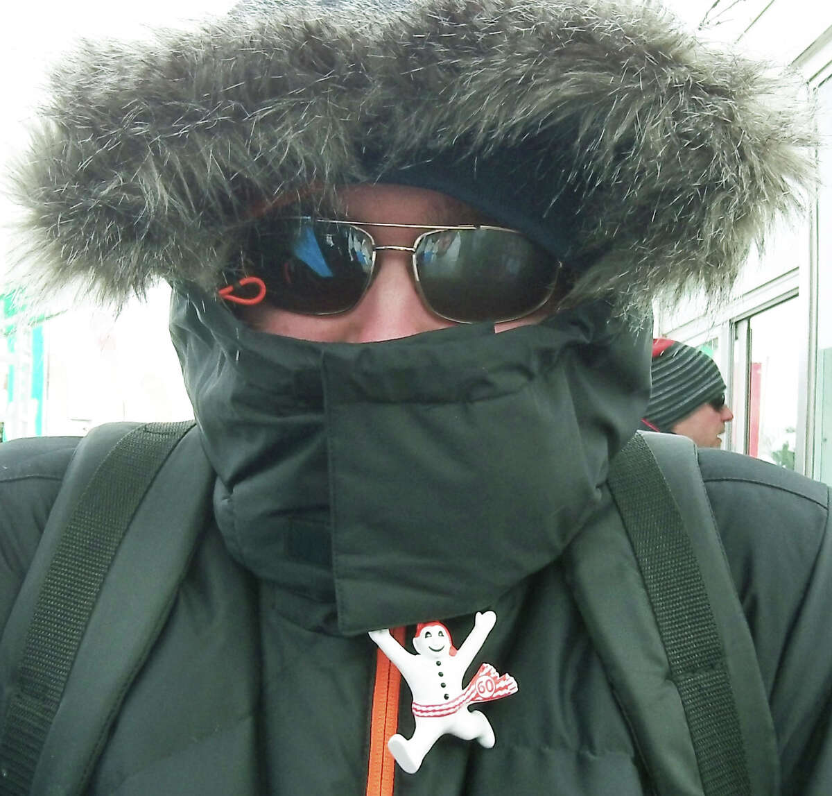 Daniel Kotas shlelds himself from the cold at Carnaval during a trip by 19 Shepaug Valley Middle/High School students to Quebec, Canada in February 2014 Courtesy of Heidi Edel