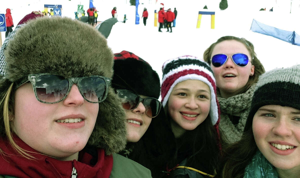A trip by 19 Shepaug Valley Middle/High School students to Quebec, Canada in February proved a rewarding experience for the students and faculty chaperones Heidi Edel and Eleni Bookis. Here, from left to right, Marie Morniere, Alex Darinzo, Dana Wachsmuth, Laurenn Desrochers and Emily Taylor discover the Carnaval Mascott, Le Bonhomme de Carnaval. February 2014 Courtesy of Heidi Edel
