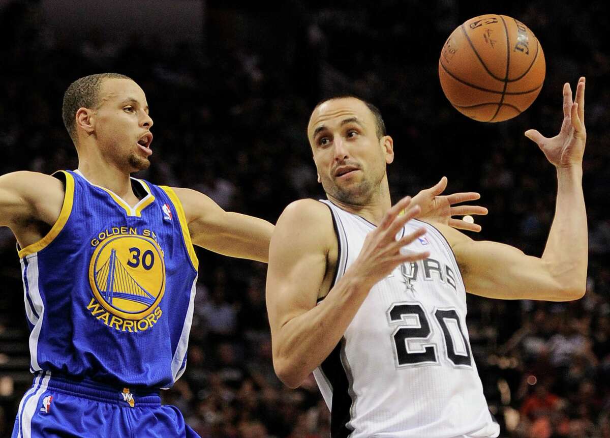 San Antonio Spurs guard Manu Ginobili, right, of Argentina, drives around Golden State Warriors guard Stephen Curry during the first half of an NBA basketball game on Wednesday, April 2, 2014, in San Antonio. (AP Photo/Darren Abate)