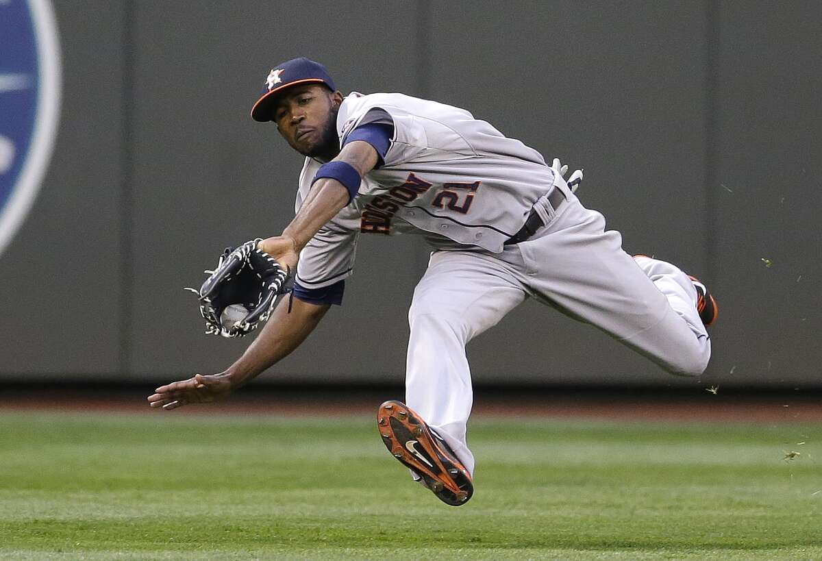 Seattle Mariners' Robinson Cano swings at a pitch in front of