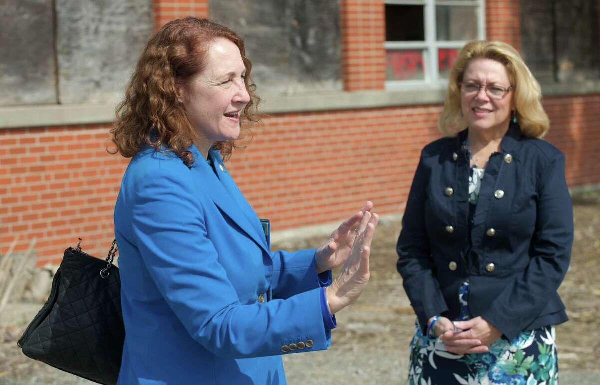 Congresswoman Elizabeth Esty, Connecticut 5th District, left, talks with New Milford Mayor Patricia Murphy at the Century Brass mill, in New Milford, Conn, where Esty announced a brownfield cleanup bill she is promoting, on Tuesday, April 22, 2014.
