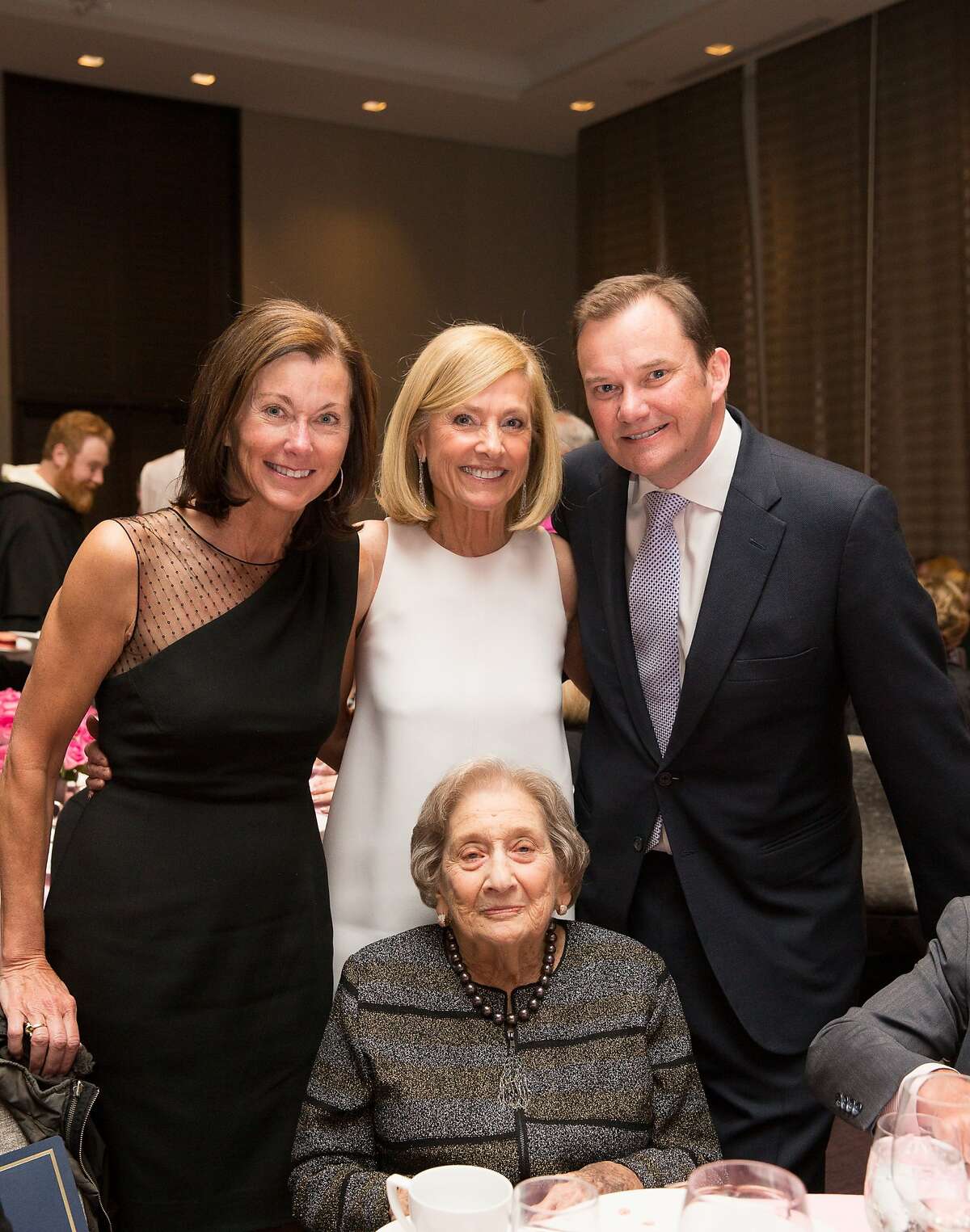Cecilia Herbert (left) with Maureen Sullivan, CCCYO Board President Simon Manning and (seated) Rita Semel at the Loaves & Fishes Gala. April 2014. By Drew Altizer.