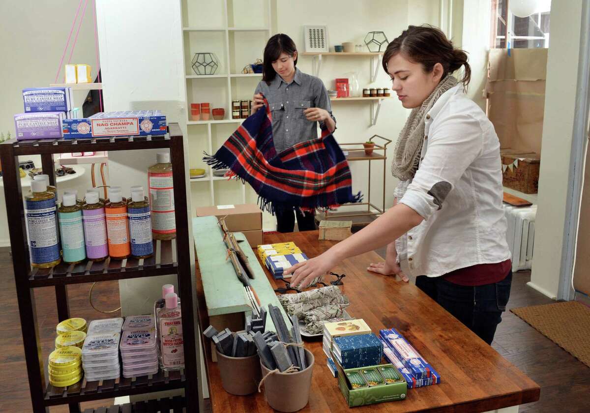 Caroline Corrigan, left, and Katy Smith at work in their soon to open Fort Orange General Store at 296 Delaware Avenue Tuesday April 22, 2014, in Albany, NY. (John Carl D'Annibale / Times Union)