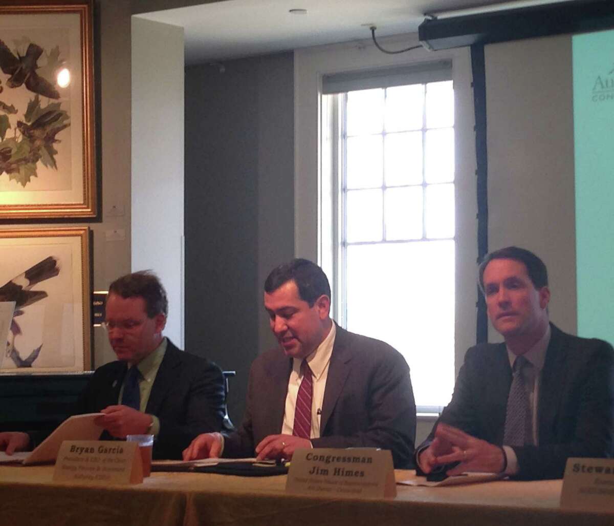 From left: Connecticut Green Building Council board member Mark Robbins, Clean Energy Finance and Investment Authority president Bryan Garcia and U.S. Rep Jim Himes discuss environmental issues during an Earth Day program at Greenwichís Audobon Center Tuesday.