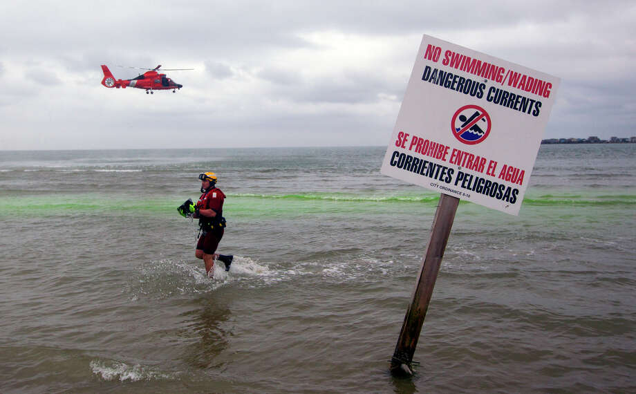 Coast Guard Chief Charles Ferrante leaves the water during a nautical rescue training through the San Luis Pass on Tuesday, April 22, 2014 in Galveston. Coastguards conduct training races in the San Luis Pass, a place that has already killed many people who drowned there. Photo: Cody Duty, Houston Chronicle / © 2014 Houston Chronicle