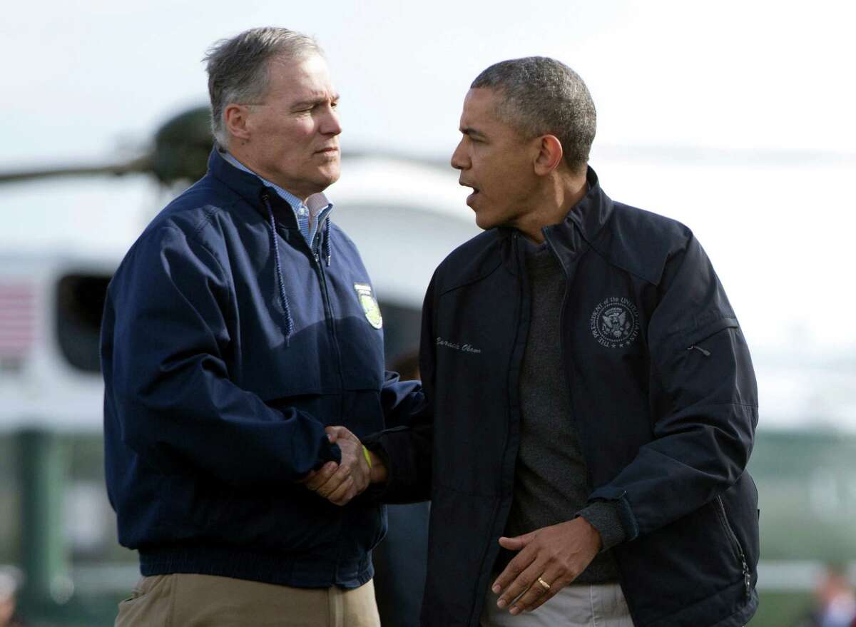 Gov. Jay Inslee with President Obama.  A landslide Obama victory helped Inslee eke out a narrow win for Governor in 2012. Will coattails at the top of the ticket help a lately embattled Inslee win reelection in 2016? (AP Photo/Carolyn Kaster)