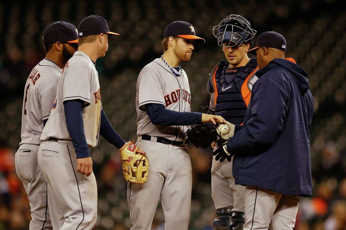 Starter Collin McHugh, left, departs after giving the Astros 62⁄3 scoreless innings Tuesday night.