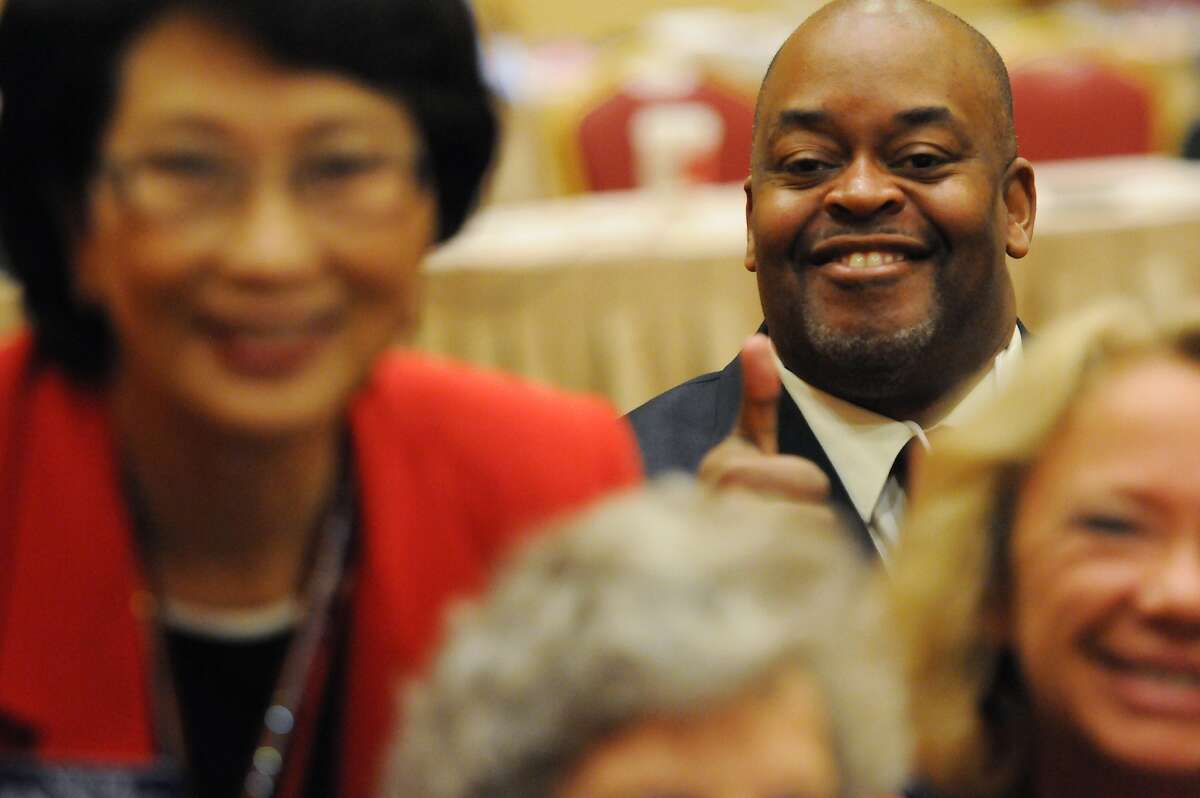 Niger Innis, rear right, Republican candidate for the 4th Congressional District, smiles for the camera during the annual Nevada Republican Party convention at the South Point casino-hotel in Las Vegas. Some Republicans are pushing for their party to drop its opposition to same-sex marriage as public opinion on the issue shifts rapidly and the party tries to woo younger voters more supportive of gay unions. (AP Photo/Las Vegas Review-Journal, Erik Verduzco)