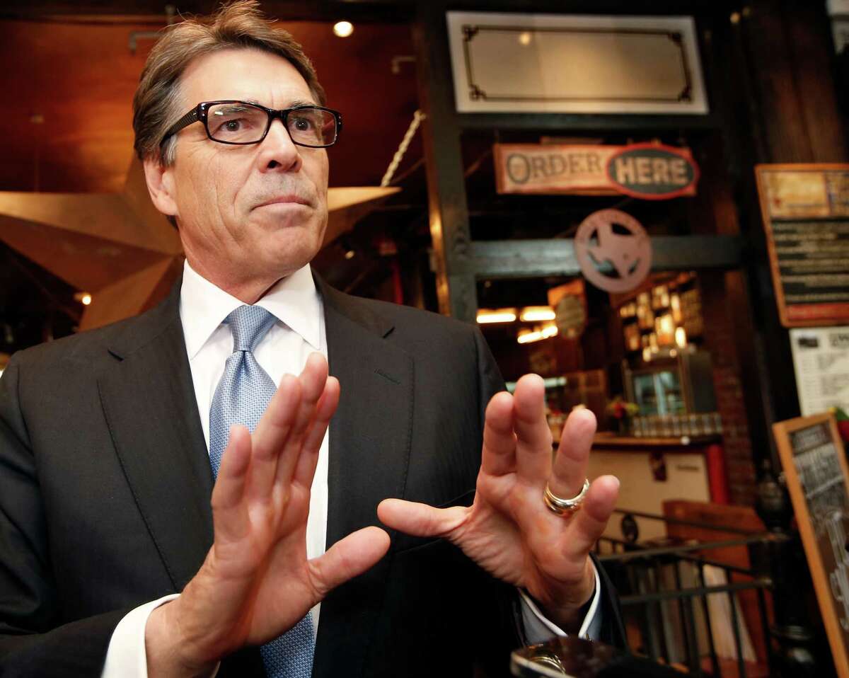Texas Gov. Rick Perry speaks to reporters after meeting with business owners Wednesday, April 23, 2014, in New York. Perry, a Republican, made the trip to try to convince companies to move their operations to Texas, where he says the business climate is friendlier. (AP Photo/Kathy Willens)