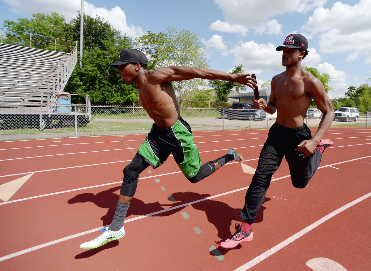 James Reed, left, and Isaiah Wilkerson practice their handoff Wednesday afternoon. West Brook High School's relay team -- Isaiah Wilkerson, Justen Hervey, Cameron McKinney, and James Reed -- poses for a picture at the school's track on Tuesday afternoon. The team won the 400-meter relay at the 21-5A track meet. Photo taken Tuesday, 4/22/14 Jake Daniels/@JakeD_in_SETX