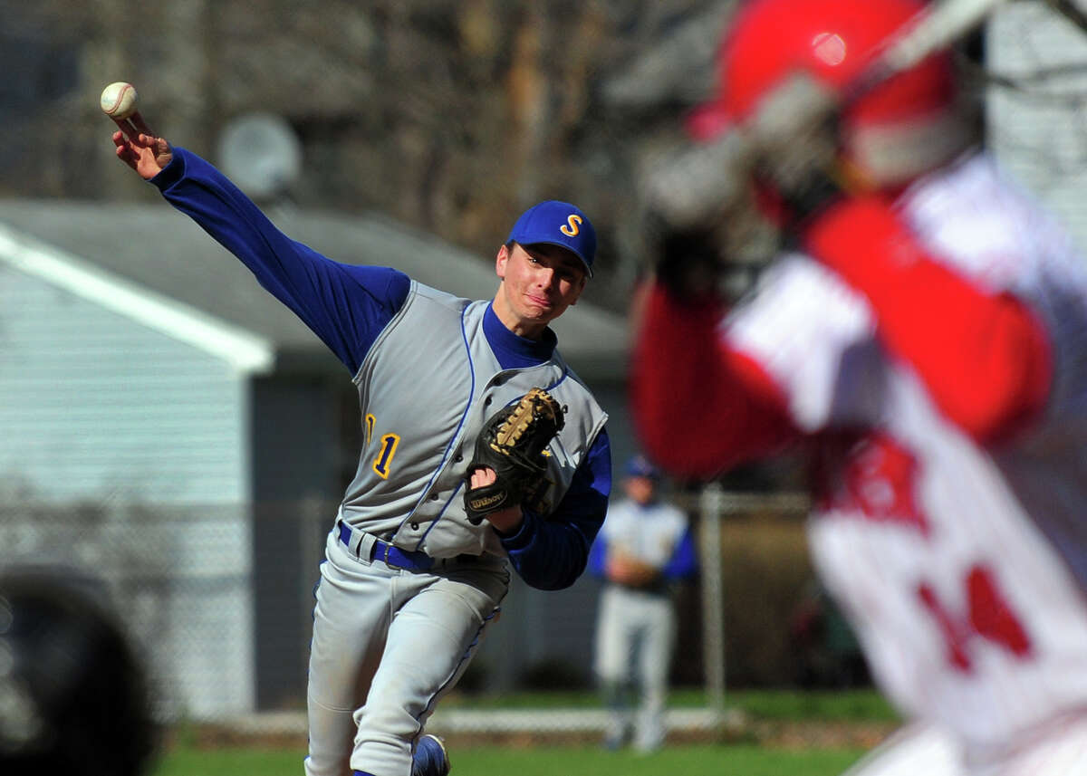 Seymour pitcher Jake Walkinshaw sends the ball to Derby's Michael Koval, during baseball action against Seymour at French Memorial Park in Seymour, Conn. on Wednesday April 23, 2014.