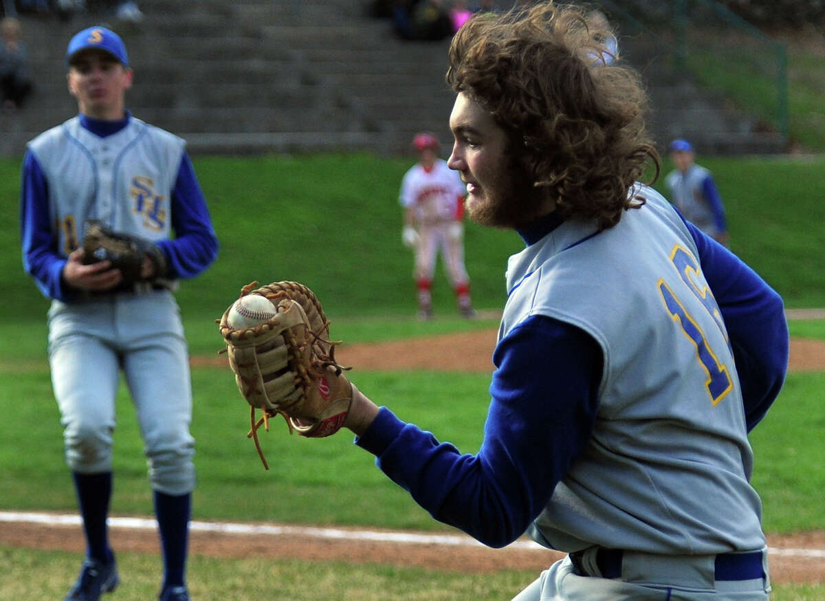 Seymour's first baseman Dan Godette makes a catch in foul territory for a Derby out, during baseball action at French Memorial Park in Seymour, Conn. on Wednesday April 23, 2014.