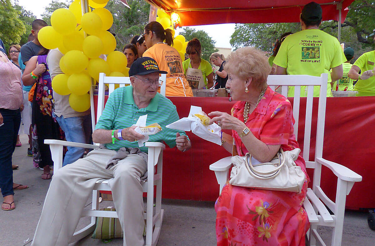 Richard A. Loring and his bride of 59 years, Ruthie Loring, enjoy corn during the annual Taste of the Northside, a food-friendly event at the parking lot of The Club at Sonterra.