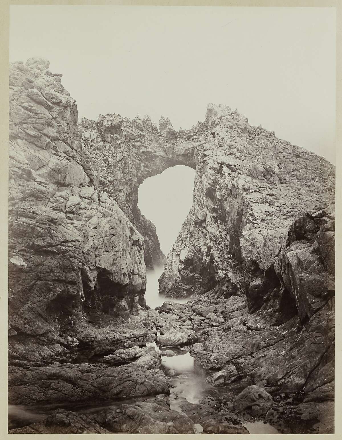 "Arch at the West End, Farallones" (1868 1869) Albumen print by Carleton Watkins,from the album Photographs of the Pacific Coast. Lent by Department of Special Collections, Stanford University Libraries