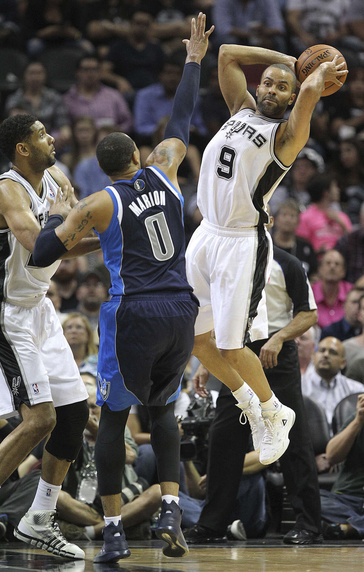 Tony Parker, passing around the Mavs' Shawn Marion, scored just 12 points on 5-of-10 shooting in the Spurs' Game 2 loss Wednesday at the AT&T Center.