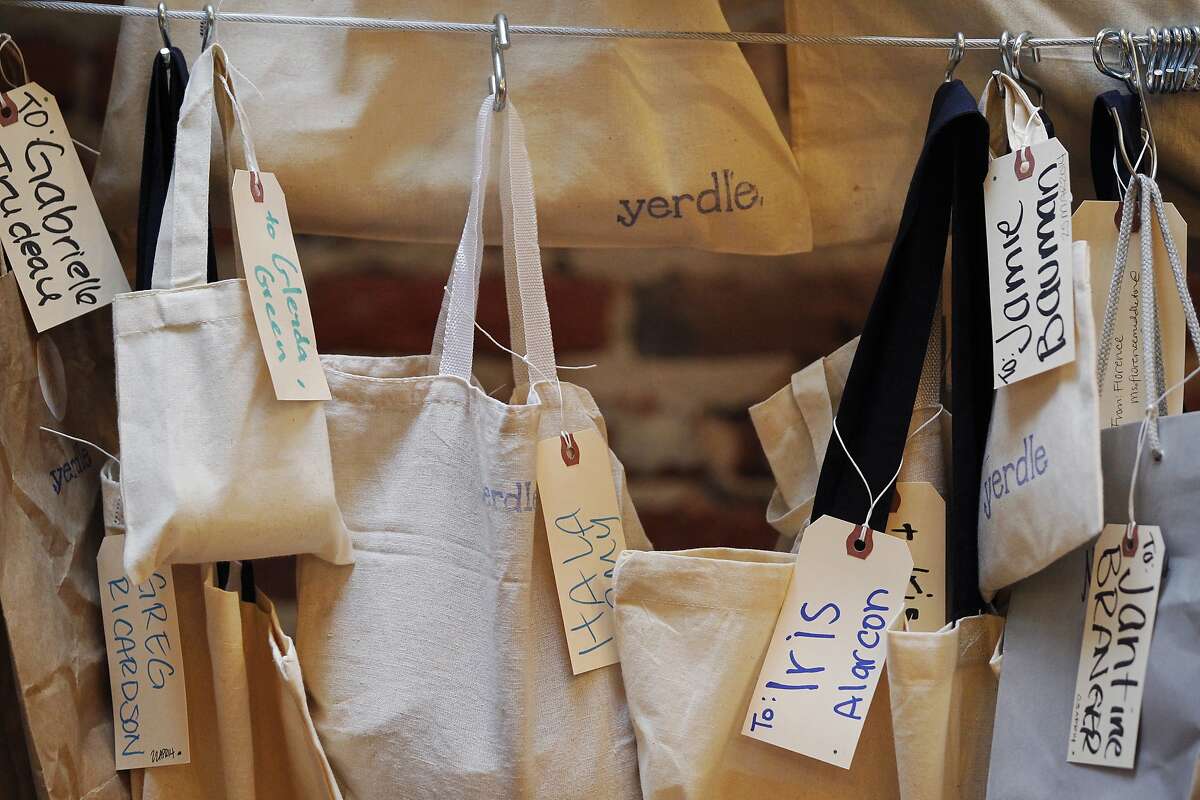 Items hang labeled and ready to be picked up at the Yerdle Share Spot during an Earth Day celebration April 22, 2014 at Yerdle's new headquarters in downtown San Francisco, Calif. The company was having an Earth Day celebration as well as recognizing that they had met their fundraising goal. The two-year-old company, which launched on Black Friday in 2012, aims to connect people together so they can exchange used items easily. "We should know about the trillions of dollars of things in our garages," said co-founder Andy Ruben.