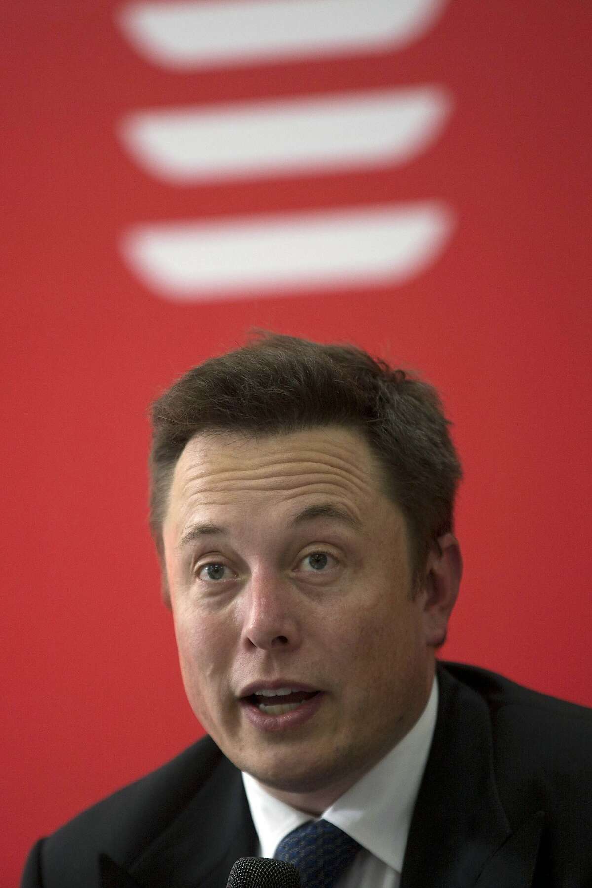 Tesla CEO Elon Musk s pay slips to less than