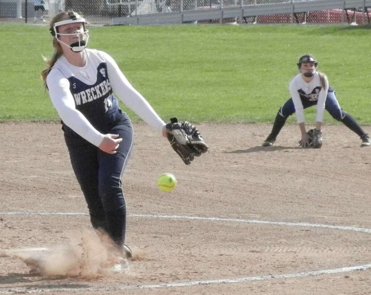 Staples freshman Gillian Birk firing to the plate in the second inning on Friday, April 25 in an FCIAC softball game at Fairfield Warde. Birk threw a no-hitter for seven innings but the host Mustangs won 1-0 on a hit by Sarah Cotto in the eighth inning.