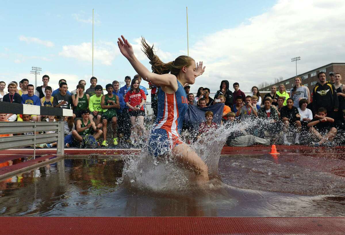 Danbury's Kaleigh Constantine competes in the 2000 meter steeplechase relay at the 34th annual O'Grady Relays track and field event at Danbury High School in Danbury, Conn. Saturday, April 26, 2014. Constantine finished 13th overall and Darien's Anne Johnston won the event.