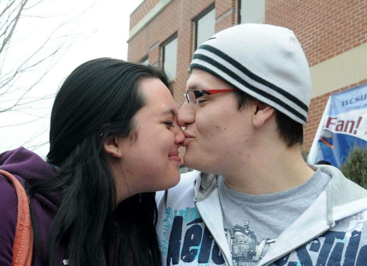 Alysha Cloutier, left, 19 of Danbury, and her boyfriend of almost a year, Mark Santaromita, 18, of Danbury spend time together after Cloutier is finished with her classes for the day on Tuesday, Feb. 2, 2010. Cloutier is a student at Western Connecticut State University in Danbury. Santaromita gives Cloutier a kiss.