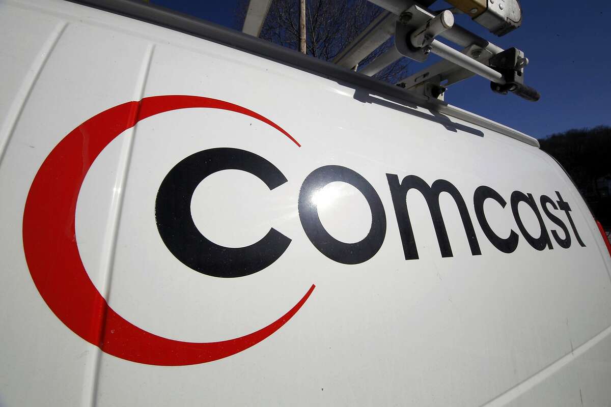 FILE - This Feb. 11, 2011, file photo, shows the Comcast logo on one of the company's vehicles, in Pittsburgh. Comcast plans to sell some cable systems to competitor Charter Communications Inc., to help Comcast's acquisition of Time Warner Cable clear regulatory hurdles, the company announced Monday, April 28, 2014. (AP Photo/Gene J. Puskar, File)