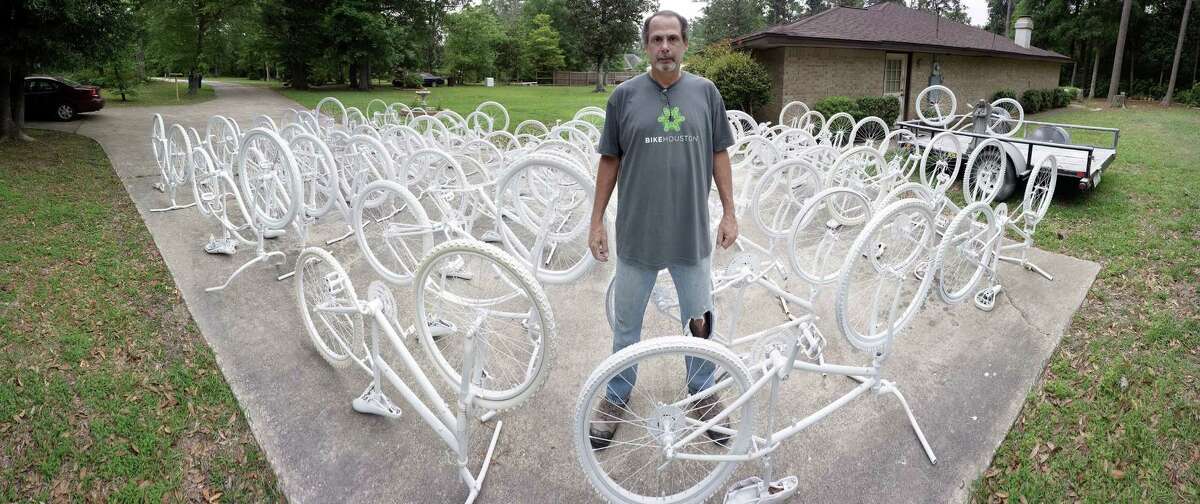 Richard Tomlinson installed 13 ghost bikes this weekend to memorialize the locations where Houston-area cyclists lost their lives. (Chuy Benitez photo)