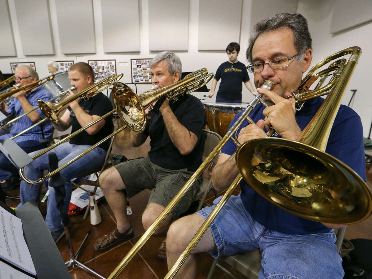 The trombone section of the Helotes Area Community Band practices during an April 21 rehearsal.