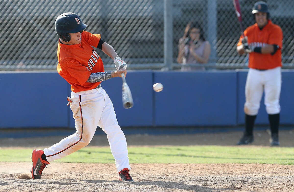 Burbank's Jonathan Martinez hits a two-run home run Thursday during the fourth inning of their game at the SAISD Sports Complex. Burbank beat Lanier 11-7 in the last regular season game for both clubs to claim the final playoff spot in District 28-4A.