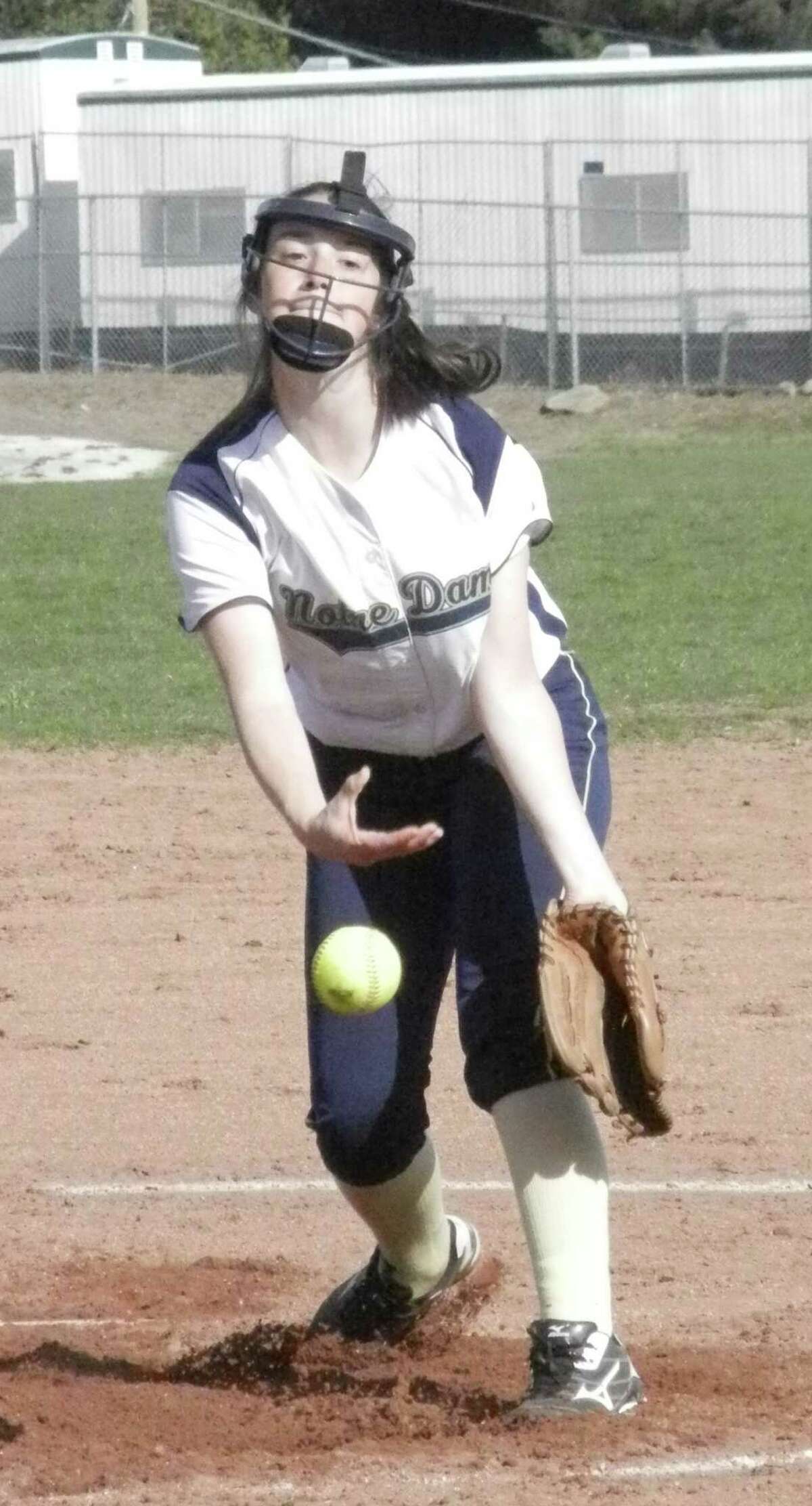Notre Dame-Fairfield freshman Shelby Nolan unleashes a pitch against Oxford on Monday, April 28 in an SWC Patriot Division softball game in Fairfield. Oxford won 5-1 and Nolan, ordinarily the Lancers' second baseman, made her first career start.