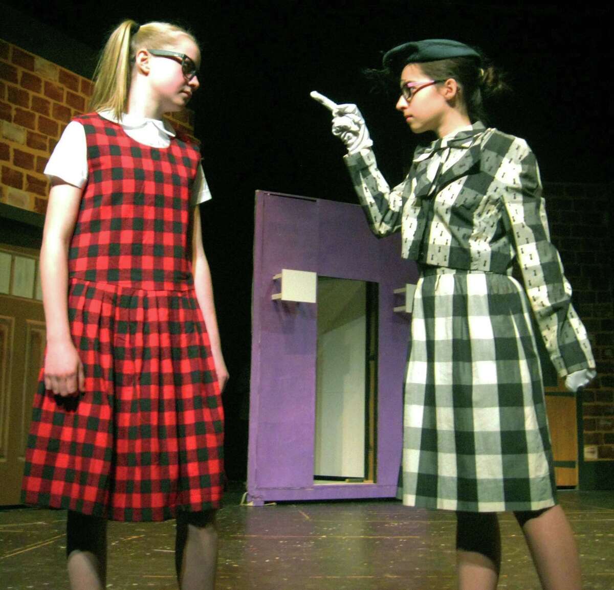 Penny, portrayed by Abigail Gorra, left, of Washington, endures an earful from Mallory Noone of Washington as Prudy Pingleton during rehearsal for Shepaug Valley Middle School's April 10, 2014 performance of "Hairspray Jr." Courtesy of Cheryl Crossley