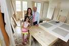 Katherine DeLaune and Lee Steely along with their daughter Ava, 9, pose for a portrait on Monday, April 21, 2014, in Houston. Their upper Kirby home is going through a major renovation. ( J. Patric Schneider / For the Chronicle )