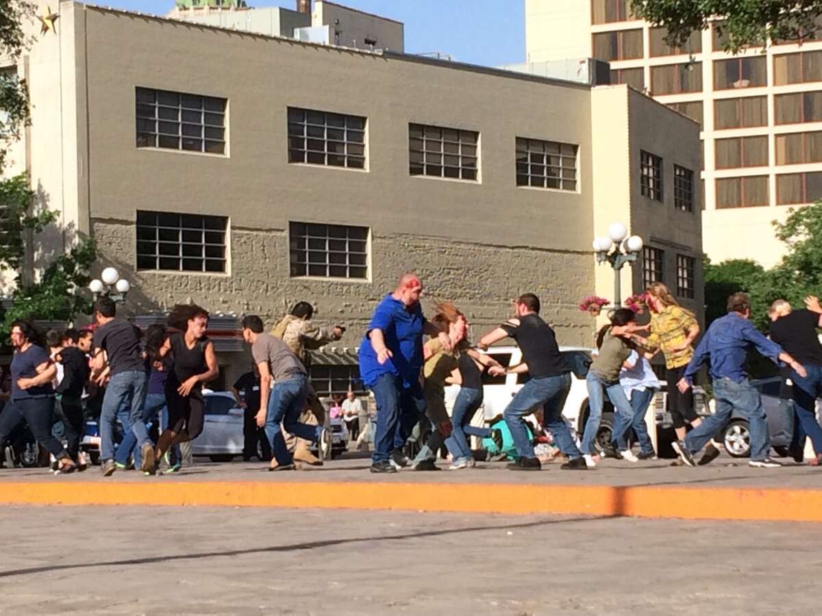 The crew of 'Zombie Reign' films in front of the Alamo on Wednesday.