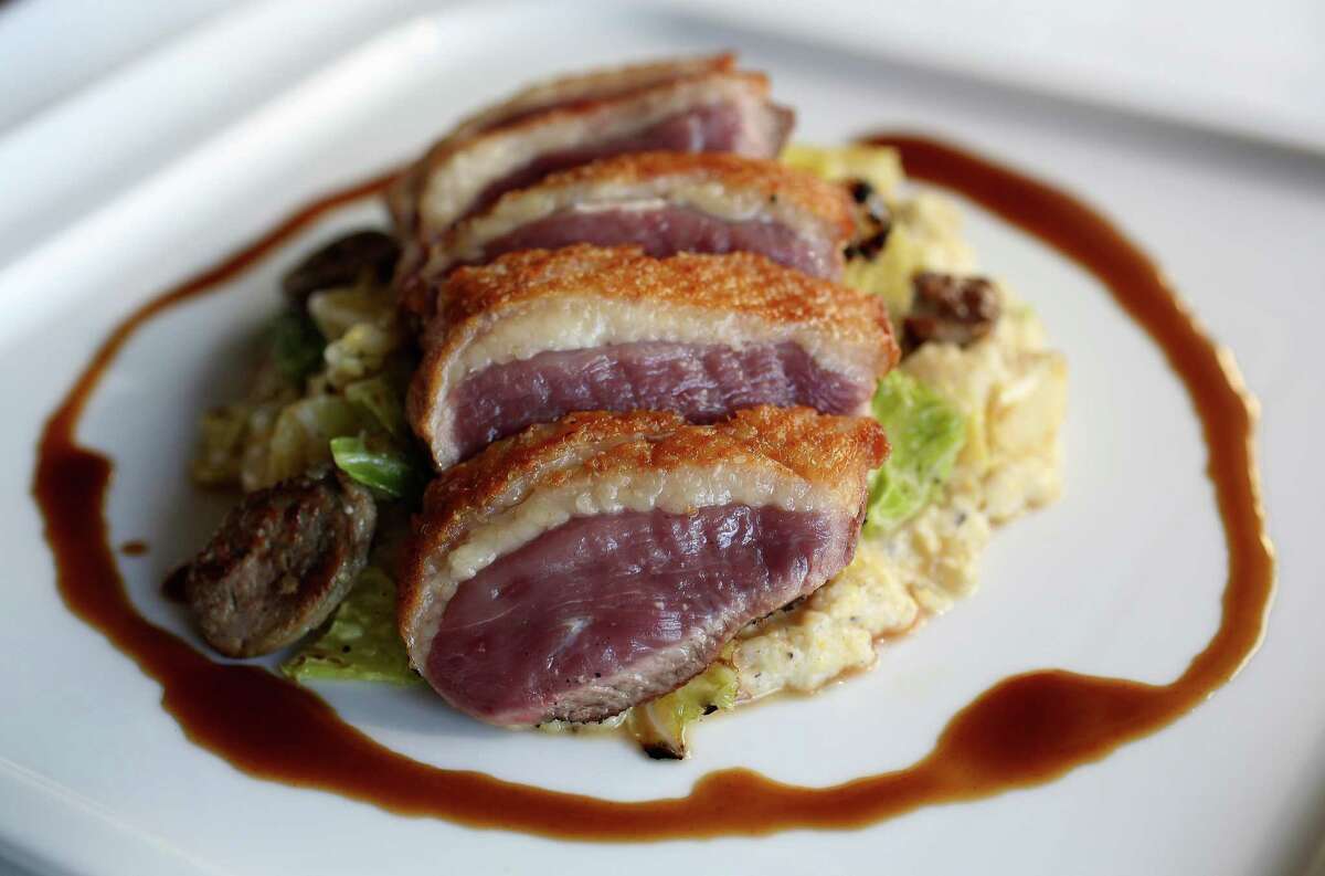 The Anatra (Rohan duck breast, buttered cabbage, duck sausage, and duck jus) at Osteria Mazzantini, Friday, Nov. 1, 2013, in Houston. ( Karen Warren / Houston Chronicle )