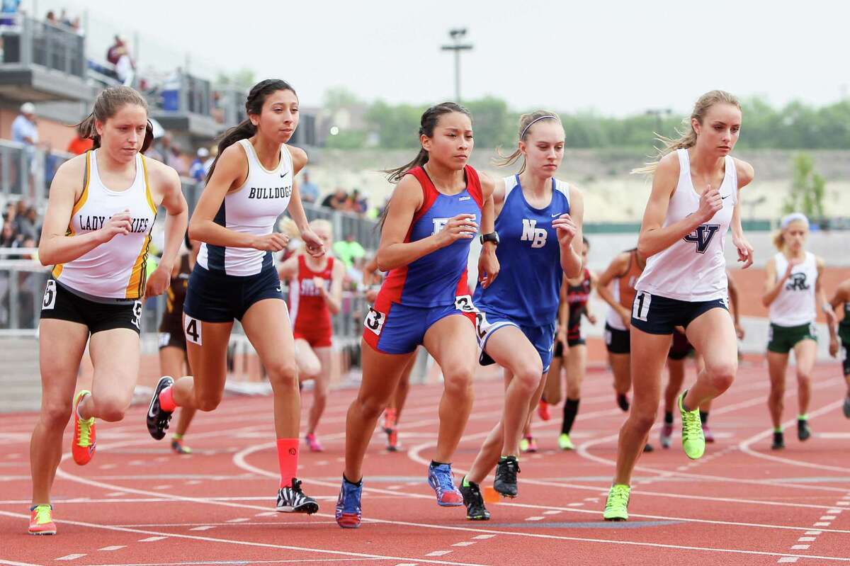 Holmes' Stephanie Barlow (from left), Laredo Alexander's Regekah Hernandez, Edingurg's Alexandria Cruz, New Braunfels' Paige Hofstad and Smithson Valley's Devin Clark take off from the starting line of the 5A 3200-meter run during the Region IV-5A and Region IV-4A track and field meets at Heroes Stadium on Friday, April 25, 2014. Clark won the event with a time of 10 minutes, 27.13 seconds. Hofstad finished second with 10 minutes, 27.99 seconds and Barlow was third in 10 minutes, 56.21 seconds. MARVIN PFEIFFER/ mpfeiffer@express-news.net